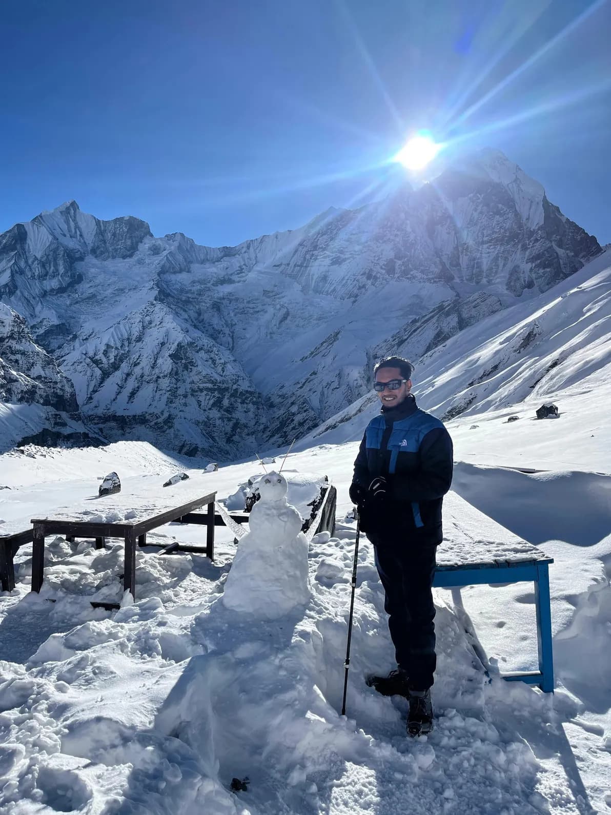 Rohit standing in fresh snow at Annapurna Base Camp, 4,130 m, the trek this page rates as needing all 12 weeks of training